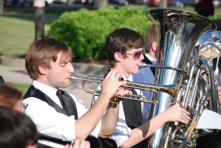 Chase Techentin, junior music major, plays the trumpet alongside Joe Lindamood, sophomore music education major, during spring graduation.