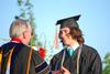 Micah Roeder, business administration graduate, receives his degree at spring graduation. - Photo by Jacob Moore