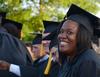 LaWanda Montague, business administration graduate, sits with fellow graduates at spring graduation. - Photo by Victoria Stargel