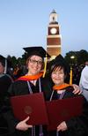 5/21/11 - Doctor of nursing practice graduates Patricia Bird and Cynthia Snyder celebrate receiving their diplomas on Union University's Great Lawn. - Zac Calvert