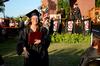Beth Spain, journalism graduate, walks back to her seat after receiving her degree at spring graduation. - Photo by Ebbie Davis