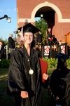 Emily Logan, music performance graduate, shows her excitement after receiving her diploma at spring graduation. - Photo by Ebbie Davis