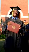 Tayo Adedokun, electrical engineering graduate, poses with his diploma at Union University's spring graduation. - Photo by Ebbie Davis