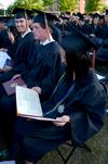 Deborah Lai, accounting graduate, admires her diploma after receiving it at Union's spring graduation. - Photo by Ebbie Davis