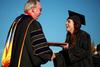 Allison Little, art graduate, receives her degree at spring graduation. - Photo by Kristi McMurry