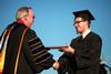 Ryan Oetting, digital media studies graduate, receives his degree at spring graduation. - Photo by Kristi McMurry