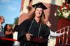 Elizabeth Whitsitt, psychology graduate, leaves the stage after receiving her degree at spring graduation. - Photo by Kristi McMurry