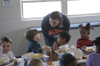 Sophomore Learning Foundations major Amanda Rushing answers a question during lunch at Parkview Montessori during Day of Remembrance 2003. - Photo by Jonathan Blair