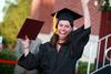 Kristen Walker, learning foundations graduate, celebrates after receiving her degree at spring graduation. - Photo by Kristi McMurry