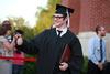 Andrew Norman, philosophy graduate, celebrates after receiving his degree at spring graduation. - Photo by Kristi McMurry
