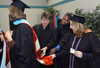 12/13/03 - Graduates make last second preparations for Fall Graduation 2003. Sheila Ferrell, MAEd graduate from Ripley, Tenn. is attended to by Kathie Cothern, MAEd graduate from Jackson, Tenn.; Everett Singleton, MAEd graduate from Brownsville, Tenn.; and Sharon Markham, MSN graduate from Eads, Tenn. - Jim Veneman