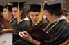 After receiving their diplomas at Fall Graduation 2003, a few graduates take time to look over their degree.  Pictured from left to right, Naomi Dodd, psychology graduate from Kingsport, Tenn.; Jennifer Hall, learning foundations graduate from Olympia, Wash.; Amanda Hardesty, special education graduate from Melbourne, Fla.; and Jennifer Langford, psychology graduate from Tullahoma, Tenn.  - Photo by Justin Veneman
