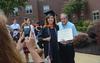 7/30/11 - Rhonda Kaye Litano celebrates with her father after receiving her master of science in nursing at Union's summer graduation ceremony. - Morris Abernathy
