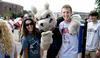 Buster the Bulldog poses with Iris Johnson and TJ Johnson, sophomore computer science major, during a break from helping new students move in. - Photo by Deanna Santangelo