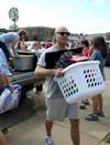 Greg Ryan, visiting assistant professor of political science, helps during New Student Move-in. - Photo by Deanna Santangelo