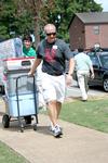 Andy Madison, associate professor of biology, and Michael O'Malley, senior English major, carry items to a room during New Student Move-in. - Photo by Deanna Santangelo