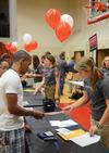 8/19/11 - Emily Smith, junior nursing major, helps Ponci Cobb, freshman pre-med major, in filling out registration forms during New Student Move-in. 