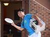 James Lui, junior psychology major, plays frisbee as he helps freshmen move into their new rooms for New Student Move-in.  - Photo by Zac Calvert