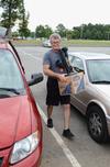 Paul Jackson, professor of Biblical studies, carries a box from a van during New Student Move-in. - Photo by Jacob Moore