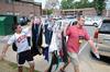 Daniel Decker, sophomore biology and pre-med major, and Evan Cantrell, sophomore youth ministry major, help by carrying a rack of clothes during New Student Move-in. - Photo by Jacob Moore