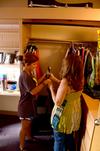 Rachel West, freshman nursing major, and her mother hang up her clothing while moving into her room during New Student Move-in. - Photo by Ebbie Davis