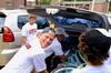 Krister Andreassen, sophomore sport management major, along with fellow soccer teammates helps unload cars during New Student Move-in.  - Photo by Ebbie Davis