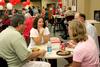 John Longworth (left), class of 1987, Sandra Longworth, class of 1986, talk with other Union alumni, Jimmy Graves, class of 1989, and Jennifer Graves, class of 1988, during the freshmen picnic in Brewer Dining Hall. - Photo by Deanna Santangelo