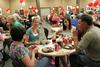 Anna Frederick (center left) talks with Kathryn Feathers and her parents, Cindy and Kenneth Feathers, during the freshmen picnic in the Brewer Dining Hall. - Photo by Deanna Santangelo