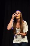 Kristen Tisdale, senior nursing major, does a skit with peanut butter at the annual Focus Show.  - Photo by Zac Calvert
