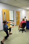 Kirby Lewis, junior chemistry major, helps freshmen in a rolling chair race during Focus week. - Photo by Zac Calvert