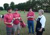 Freshmen Caleb Thompson, Grant Wilson, and Joey Moore talk with Lanese Dockery, first lady of the university, outside of her home during the annual ice cream social for new students.  - Photo by Jacob Moore