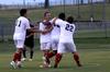 Diego Santos and his teammates celebrate after he scored a goal for the bulldogs.  - Photo by Ebbie Davis