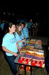 Ruth Minor, senior nursing major, serves candy at the Movie on the Lawn, hosted by Student Activities Council. - Photo by Ebbie Davis