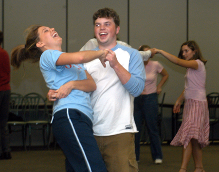 Junior Lauren Oldham and Junior Brandon Nelms practice some newly acquired moves during an educational class on swing dancing at Swing Nite.