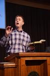 Chris Mathews, chair of the department of music, leads the congregation in music during chapel. - Photo by Zac Calvert