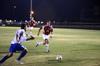 Cody Styx, sophomore business administration and management major, races a Notre Dame College opponent to the ball.    - Photo by Zac Calvert