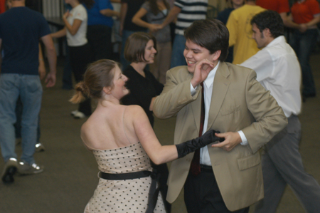 Newlyweds Chad and Liz Carlson shake it like a Polaroid picture at an educational class on swing dancing during Swing Nite.
