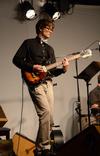 Greg Thornbury, dean of the school of theology and missions and vice president for spiritual life, plays guitar in Barefoots Joe during an opening act for folk-pop band Seryn. - Photo by Jacob Moore