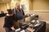 Wanda Calvert, director of production services, and Mike Calvert look at the Bibles on display at the KJV400 Festival: Legacy and Impact. - Photo by Morris Abernathy