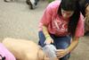 Students learn and practice mouth-to-mouth resuscitation in a PEWS class.  - Photo by Kristi McMurry