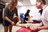 Students practice taping in a PEWS class.  - Photo by Kristi McMurry