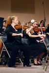 Violinists Tricia Wilburn (left) and Anna Frederick perform during the music department's "Sounding through the Centuries" concert, a part of the KJV400 Festival: Legacy and Impact. - Photo by Anne Richoux