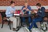 David Clay, senior economics major, talks to freshmen, Daniel Poore, media communications major, and Jill Taylor, photography major, during the Labor Day picnic at the Bowld Student Commons.  - Photo by Anne Richoux