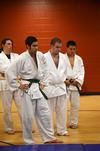Zach Preston, Stephan Rabenhorst, Jonathan Rogers, and Peter Yu watch as judo instructor Mario Melendez shows the club the proper way to fall to the ground.  - Photo by Zac Calvert