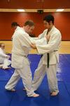 Jonathan Rogers, senior applied linguistics major, and Stephan Rabenhorst, sophomore political science major, practice initial steps in a judo throw.  - Photo by Zac Calvert