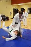 Patrick Parker, Judo master, throws Tyler Hardee, senior chemistry major, during as an example throw for other students in the club. - Photo by Zac Calvert