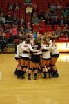 The Lady Bulldogs volleyball team gathers mid-court prior to a game against Lyon College to get ready for the match.  - Photo by Anne Richoux