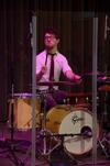 Aaron Beasley, graduate assistant to the Office of Spiritual Life, plays drums during Family Weekend chapel. - Photo by Jacob Moore
