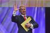 Former British Prime Minister Tony Blair waves to the audience after his speech. Blair spoke of his efforts in the Middle East to secure a lasting peace. - Photo by Morris Abernathy