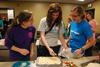 Samantha Dodson, senior education major, Kylie McDonald, junior political science major, and Nicole Haynes, junior psychology major, prepare food during Basics 101, a residence life event for female students. - Photo by Anne Richoux
